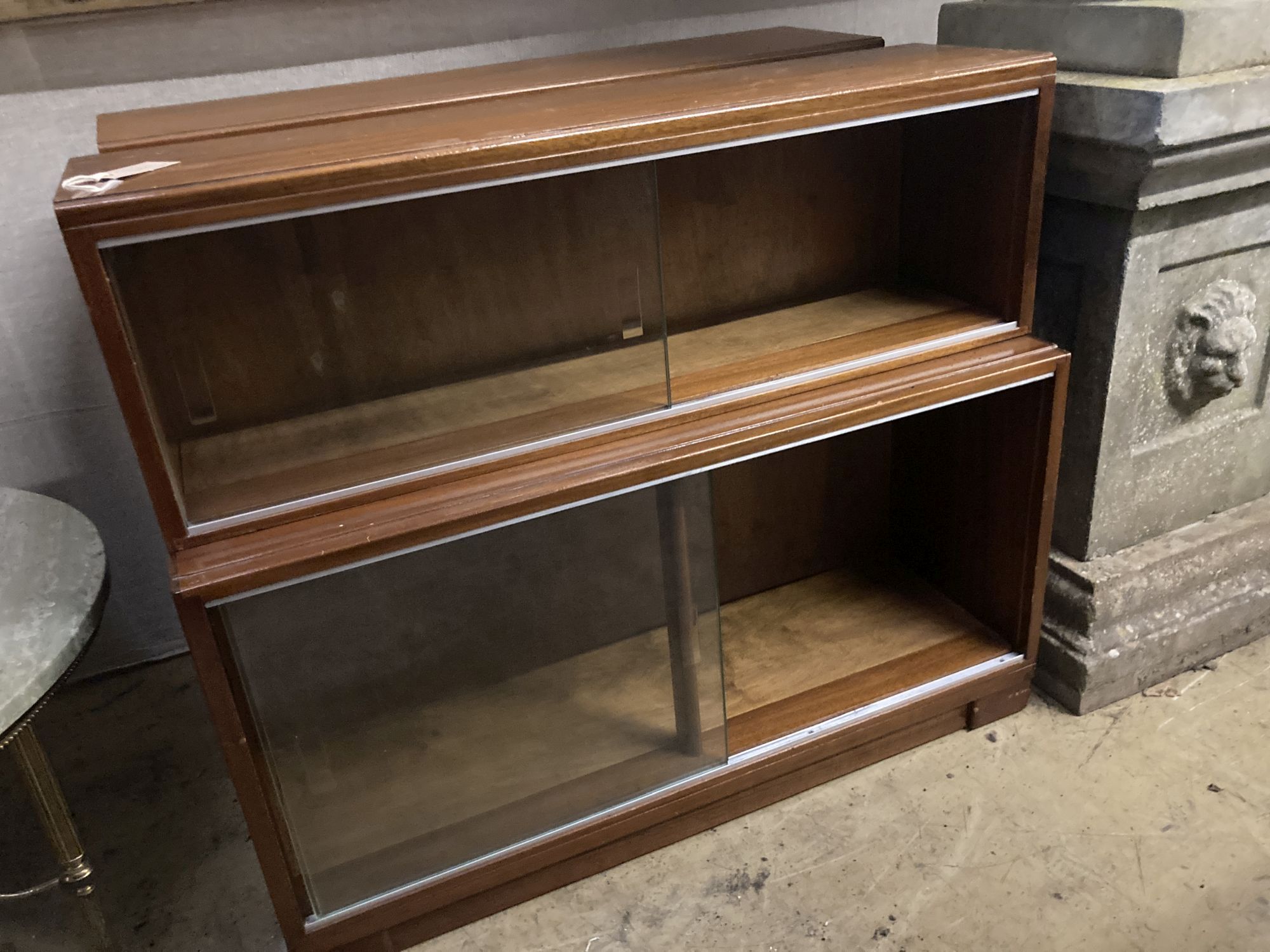 A pair of Minty style teak two section bookcases, width 89cm depth 29cm height 76cm